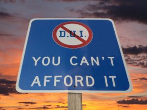 Sign that says DUI DWI will cost you